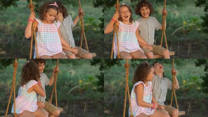 恋爱中的孩子夫妇牵着手坐在跷跷板上。一个男孩和一个女孩在耳边互相窃窃私语，开心地笑了起来。暑假