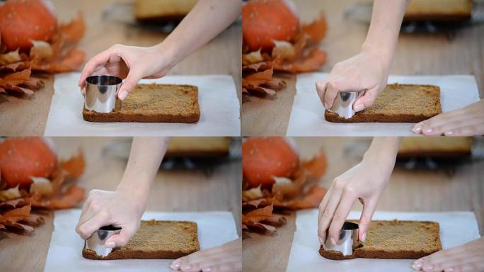 制作南瓜迷你蛋糕。从桌子上的面团上切饼干。