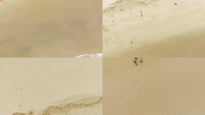 在海滩的沙地上进行空中射击