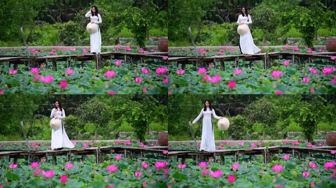 越南妇女在莲花球场上拿着莲花的慢动作镜头