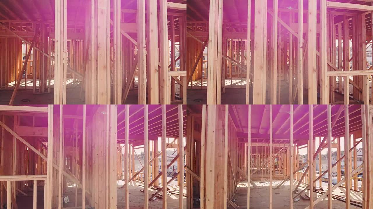 一栋未完工物体上的木屋框架在建筑框架下关闭一栋新房子