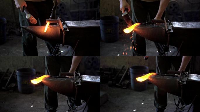 铁匠用锤子塑造铁