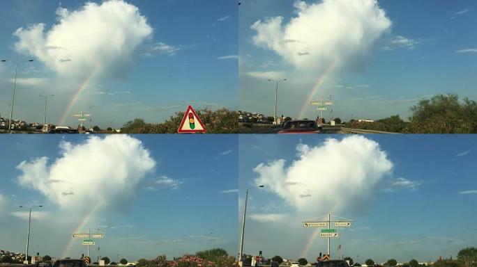 土耳其伊兹密尔的博尔诺瓦镇，高速公路上的彩虹，车上有交通标志