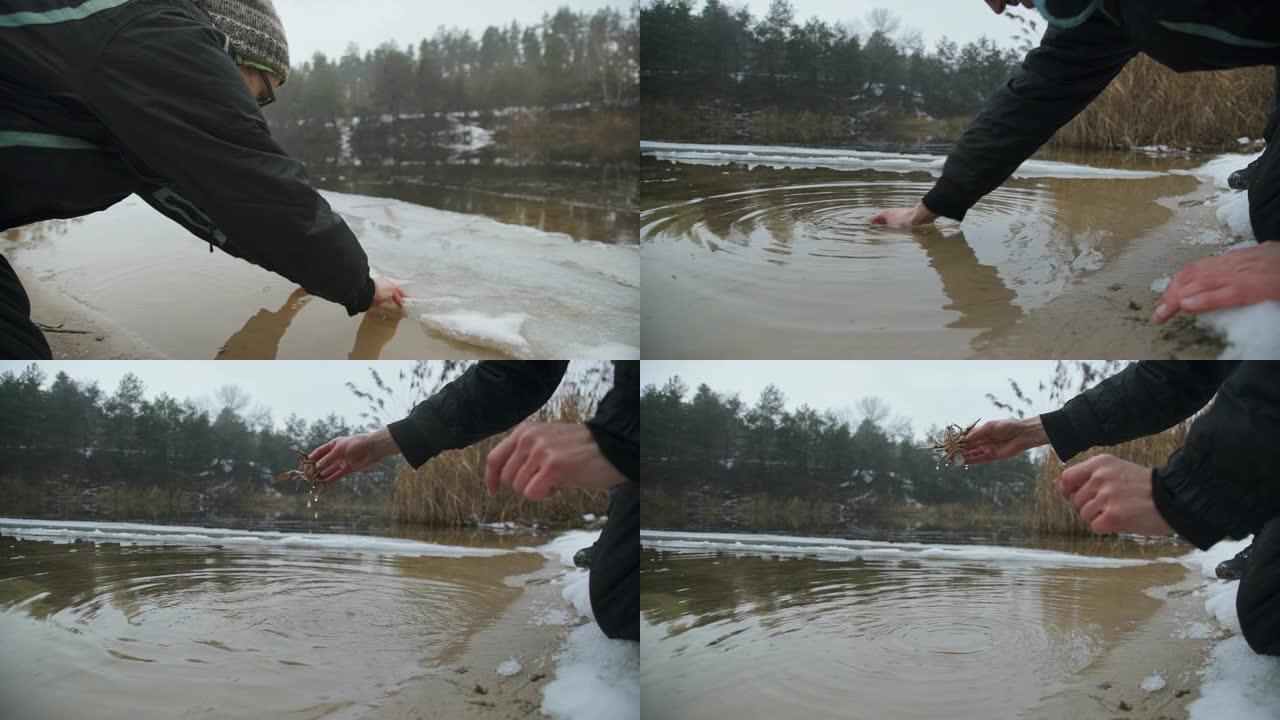 冰冷的河里的家伙掏出一只小龙虾