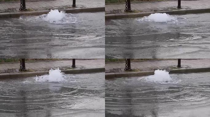 由于地下水管破裂，道路排水系统出水的镜头