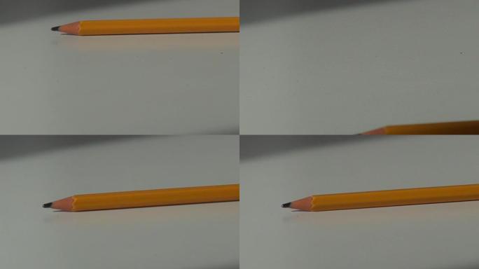 在办公桌上滚动的木制铅笔