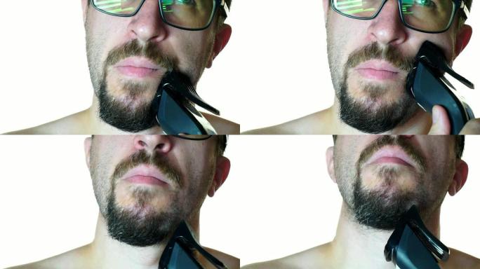 一个戴眼镜的男人的特写剃掉了胡须。在白色背景上
