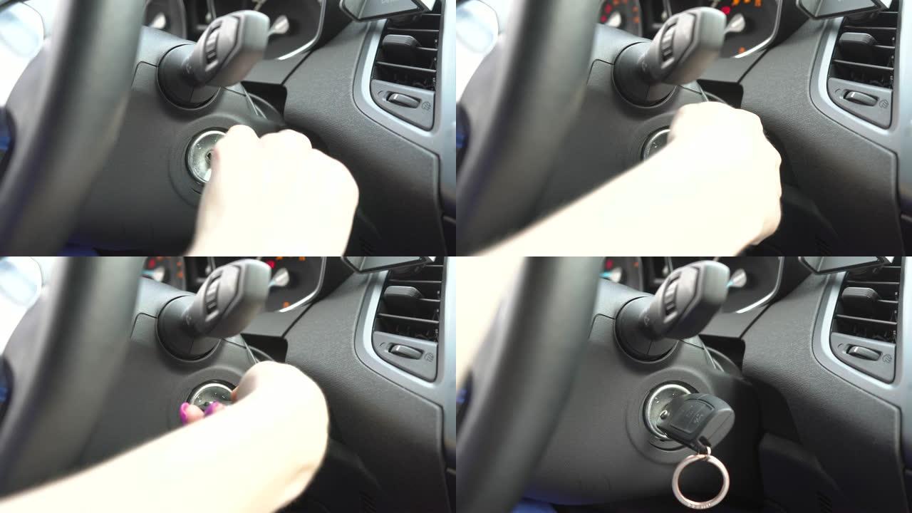 女人的手把钥匙放进点火装置，放在那里。她坐在车里。它的设备是黑色的。
