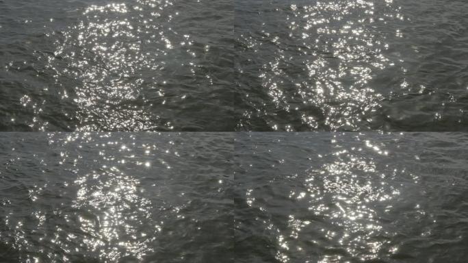 美丽的蓝色多瑙河慢动作水面波浪和太阳反射