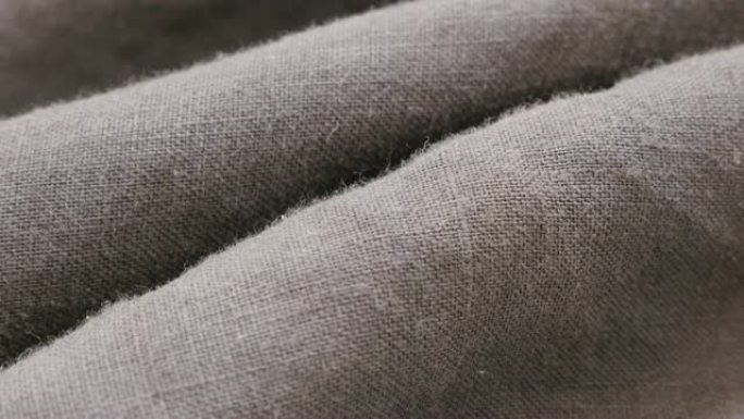 亚麻植物的深色亚麻织物，用于衣服特写细节4K 2160p 30fps超高清倾斜镜头-亚麻材料的高质量