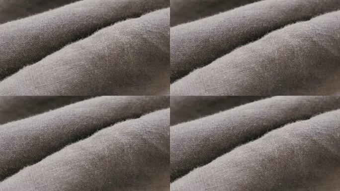 亚麻植物的深色亚麻织物，用于衣服特写细节4K 2160p 30fps超高清倾斜镜头-亚麻材料的高质量
