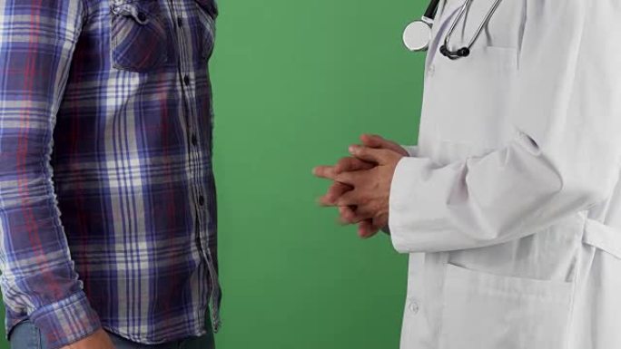 医生在chromakey上与病人握手