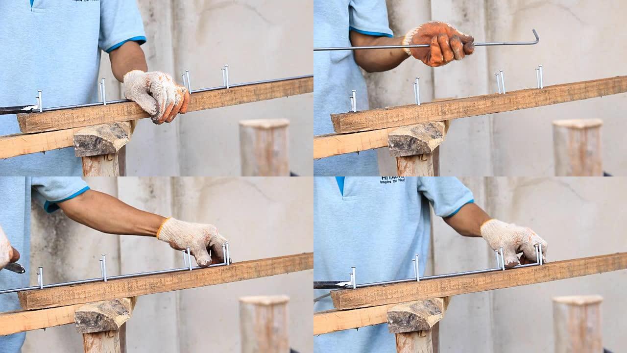 工业建筑施工工人在棒材上加工金属丝