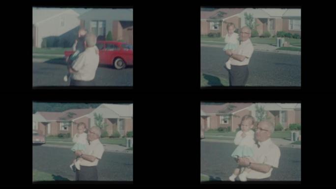 1964骄傲的祖父抱着漂亮的小孙女