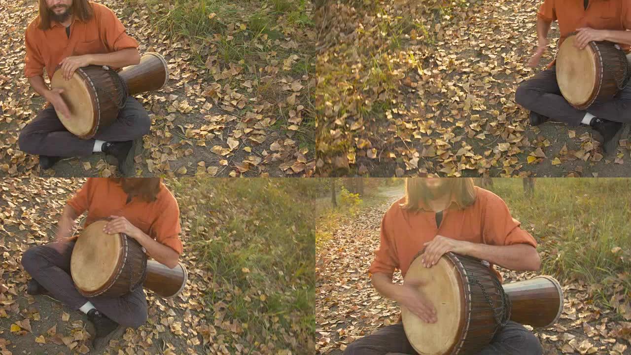 嬉皮士在秋天的森林里演奏djembe鼓