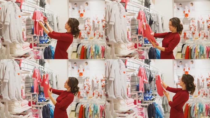 女人在商店里选择婴儿衣服或童装