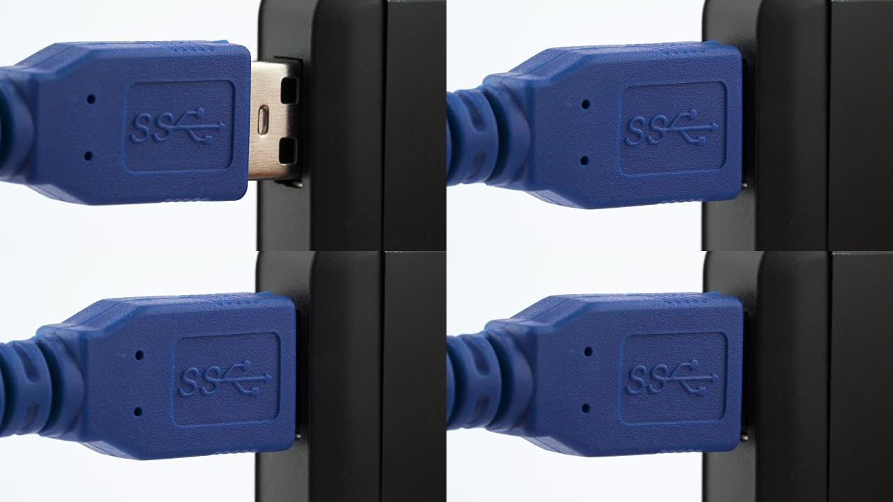 特写，微距拍摄一个蓝色的USB 3.0插头，插入USB端口，然后拔出。垂直方向。孤立在白色背景上。