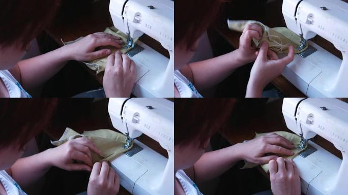 女人缝在缝纫机上。双手特写。