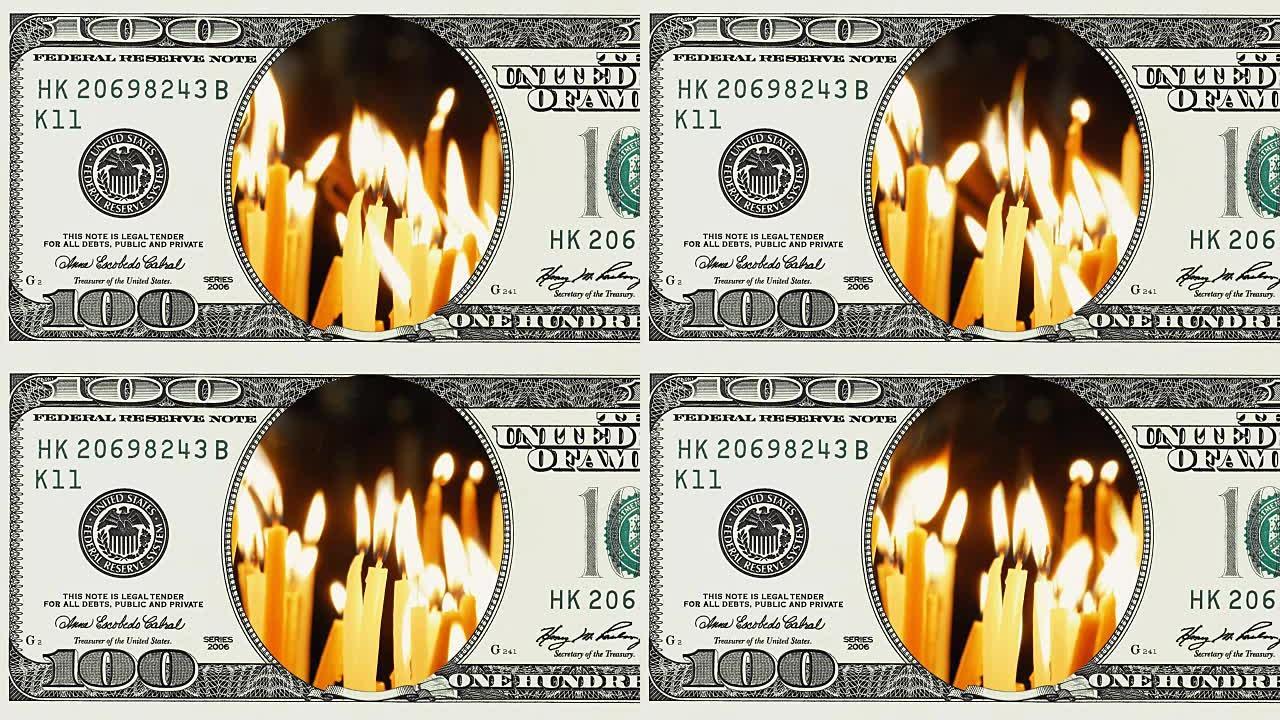 在100美元钞票的框架中燃烧蜡烛
