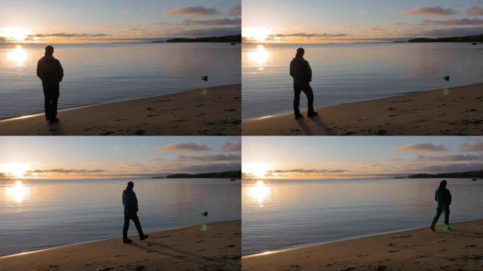 一天的开始。一个人在美丽的湖畔遇见黎明。他欣赏风景。