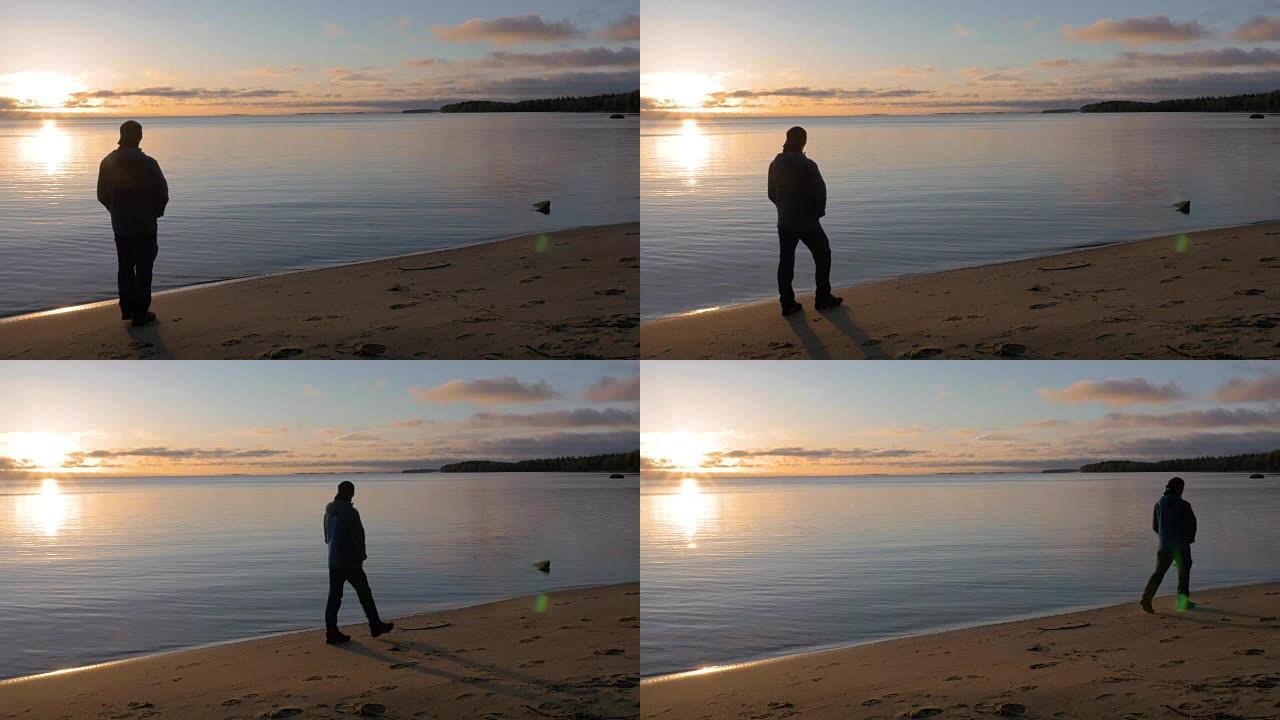 一天的开始。一个人在美丽的湖畔遇见黎明。他欣赏风景。