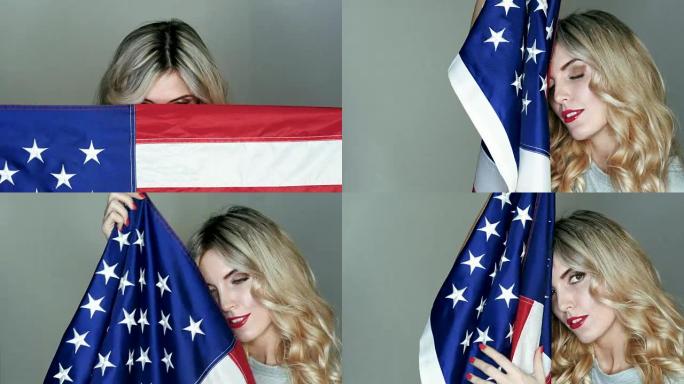 美国国旗在一个漂亮的金发女郎手中