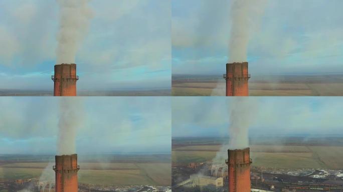 鸟瞰图。工业管道向大气排放。用无人机击打的烟囱管。特写
