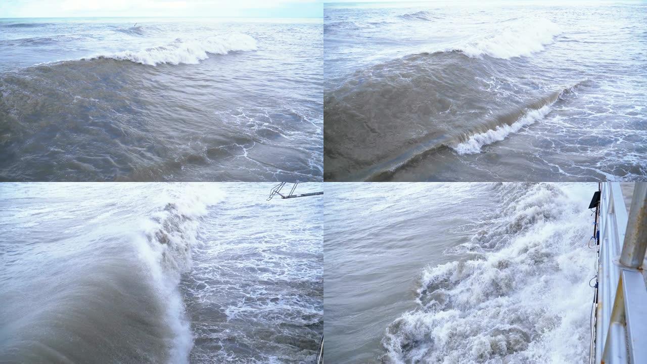 海上风暴。巨浪在岸上轰鸣、喷溅。慢动作