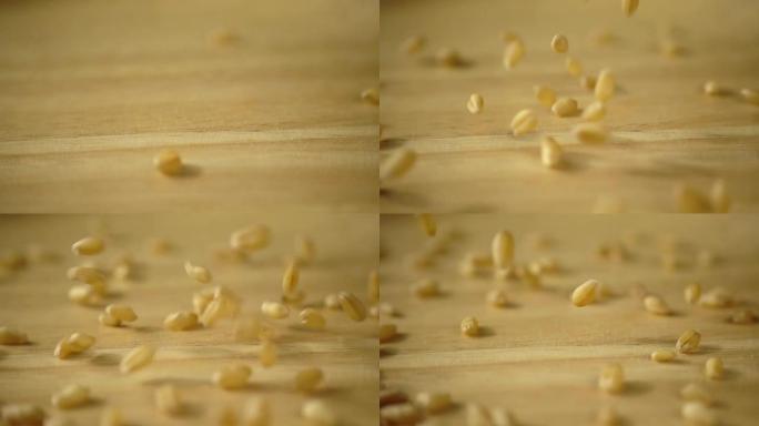 麦粒以慢动作下落，特写镜头