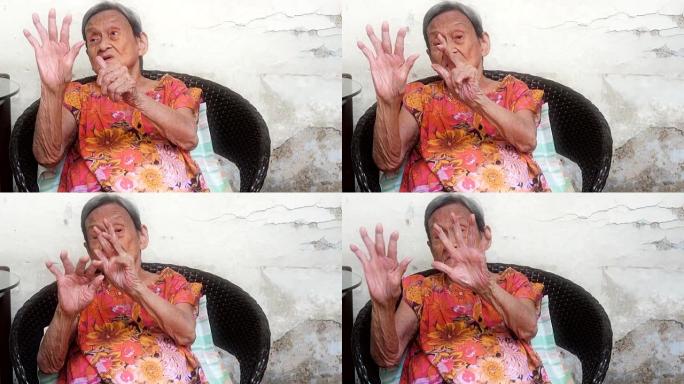 90岁以上的健康老妇在锻炼她的大脑，正面看。