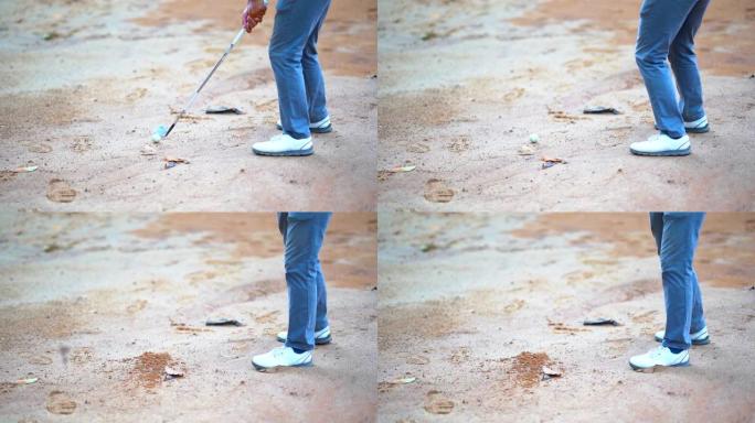 沙坑中的慢动作高尔夫球手挥杆高尔夫球