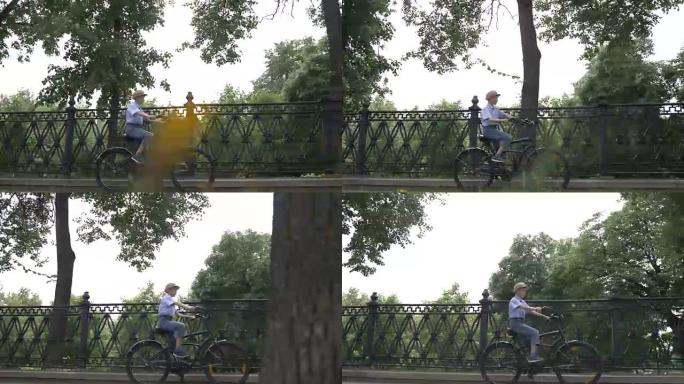 戴着帽子的快乐男孩在户外的城市公园骑自行车