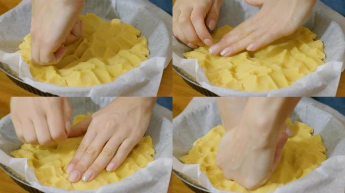 用手制蛋糕的指关节准备和压碎新鲜面团