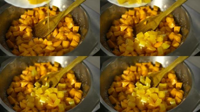 厨师准备南瓜菜并添加橙片特写