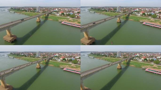 空中无人机在横跨湄公河的桥梁上飞行