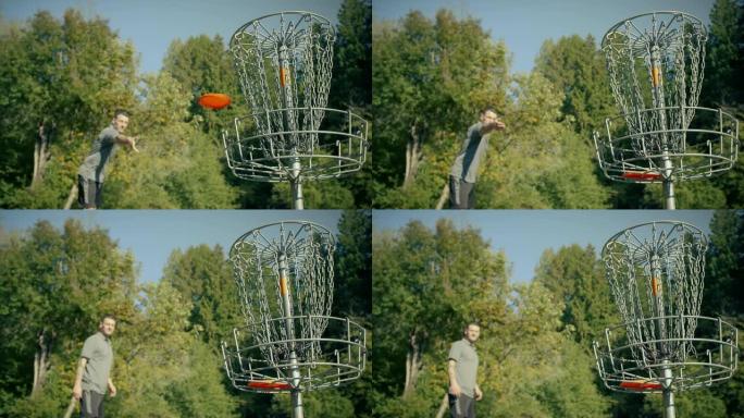 练习飞盘高尔夫的人将圆盘扔在篮子里