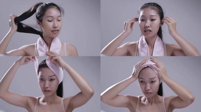 女人正在用头巾化妆。