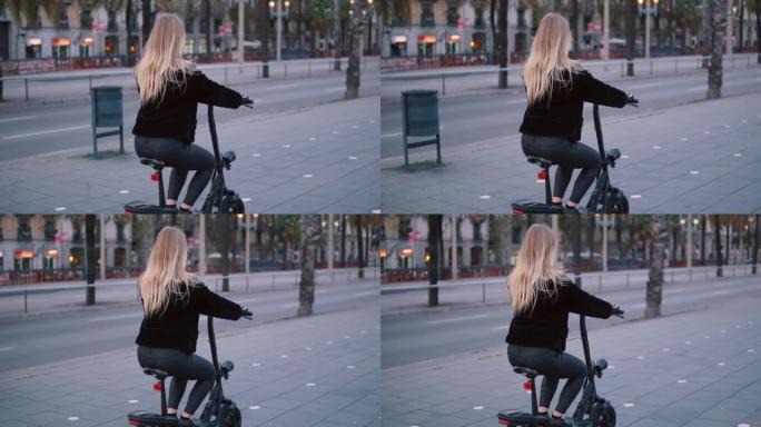 漂亮的金发女人在城市里驾驶电动自行车