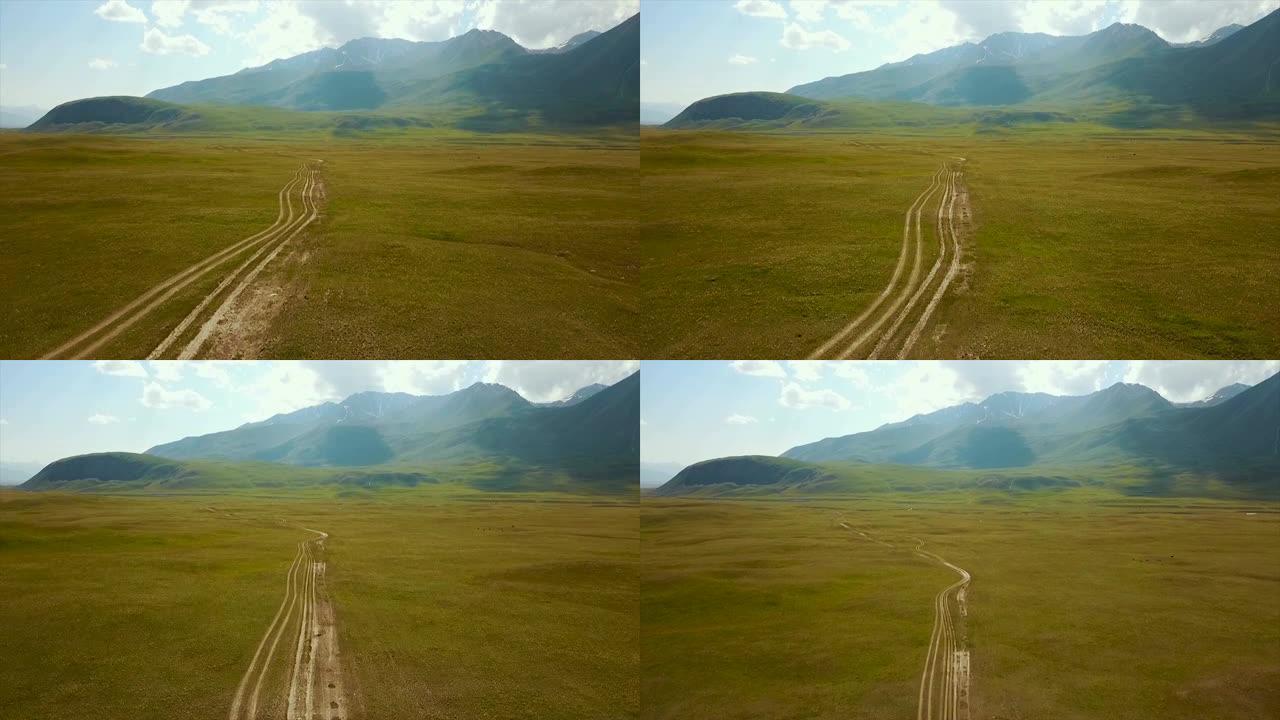 卡尔达莫山口Ak-kya-Kazarman下坡或水平道路。吉尔吉斯斯坦靠近卡扎曼的山脉。吉尔吉斯斯坦