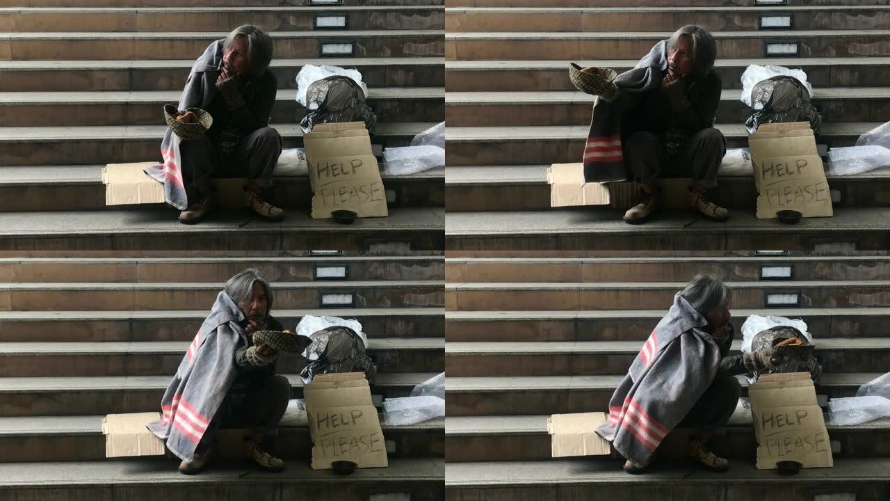 无家可归的人坐在楼梯上乞讨人们