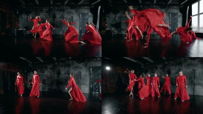 十几岁的女孩在排练室里表演舞蹈，穿着红色连衣裙，跳跃和旋转