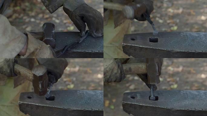 乡村铁匠的慢动作完成了铁钉的锻造
