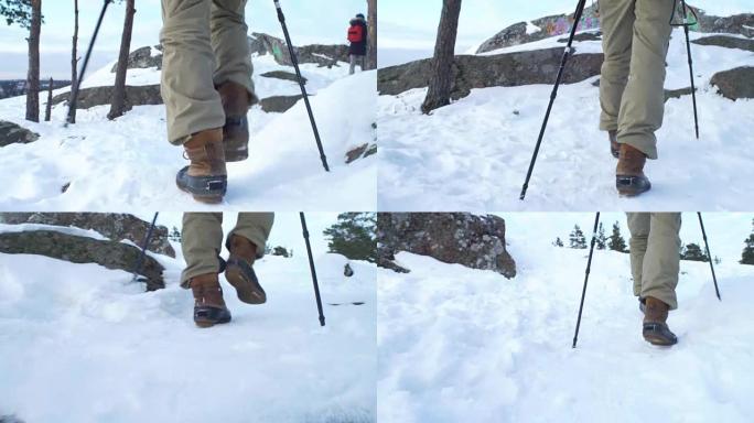 年轻人在山区冬季徒步旅行，背包客在雪地上行走