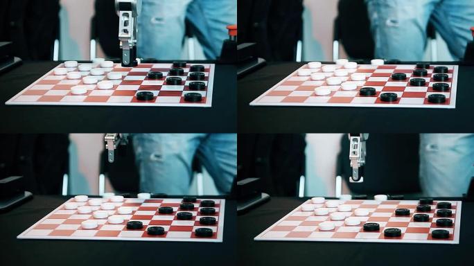 机器人在游戏中心与一名男子玩跳棋