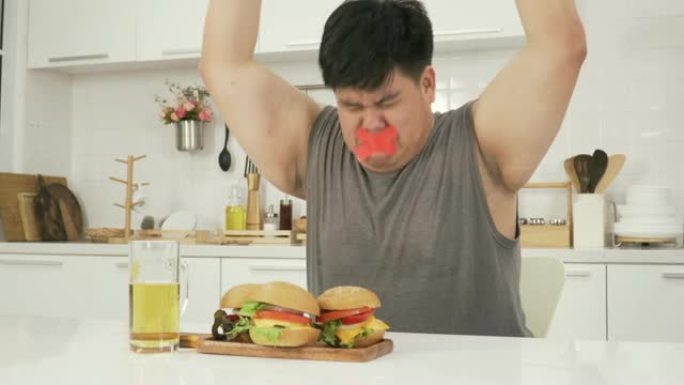 侧视: 泰国超重男子禁止食用汉堡包、啤酒等不健康食品