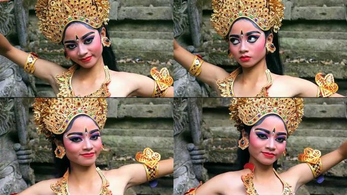 年轻的巴厘岛舞者在印度教寺庙中表演勒贡舞