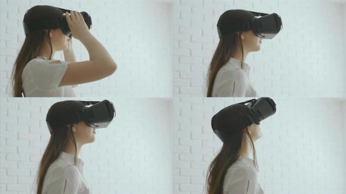 年轻女子用现代虚拟现实眼镜触摸东西，4k