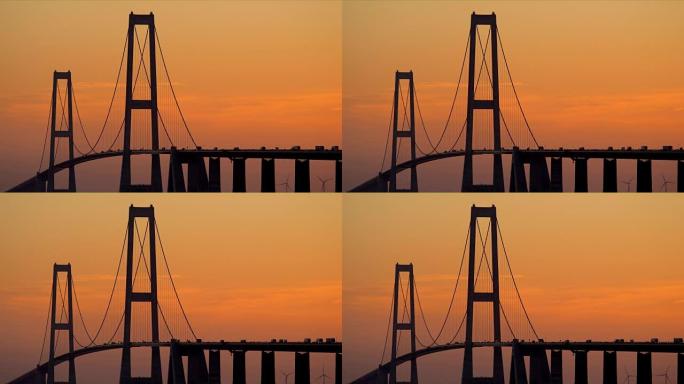 黎明时分，在橙色的天空下看到大皮带桥
