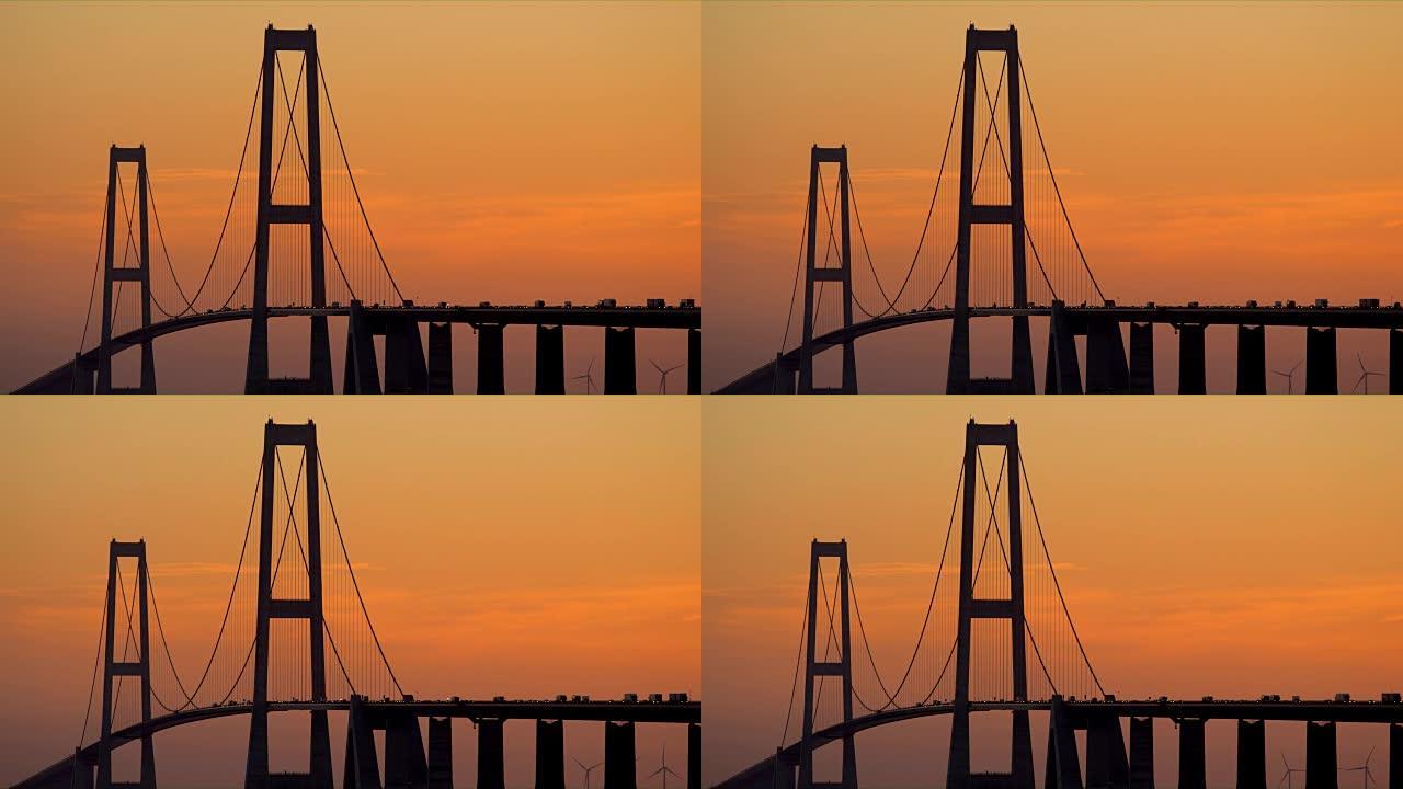黎明时分，在橙色的天空下看到大皮带桥