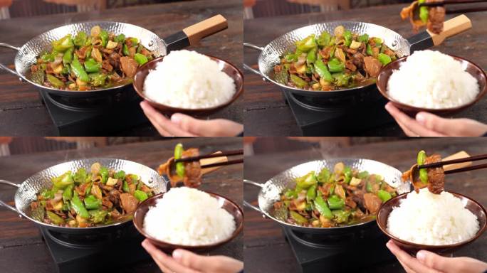 辣椒炒肉被筷子夹到碗里